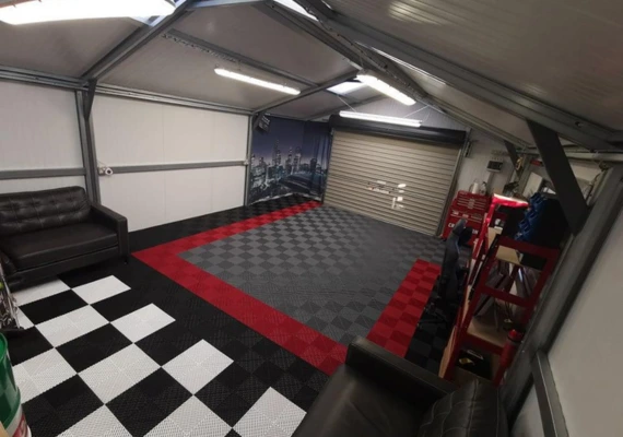 Garage floor tiles in red and black and white like a finish flag